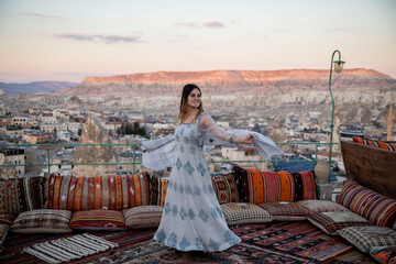 beautiful girl spinning in traditional dress in Cappadocia turkey