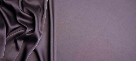dark purple silk fabric as background, top view with space for text. banner design