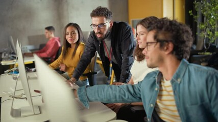 Wall Mural - Lecturer Helps Scholar with Project, Advising on Their Work. Teacher Giving Lesson to Diverse Multiethnic Group of Female and Male Students in College Room, Teaching New Academic Skills on a Computer.