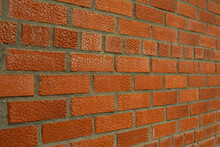Brick With Texture. The Wall Of Red Brick Is Removed On The Squint.
