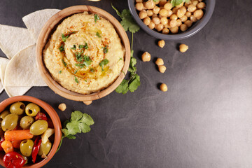 Poster - bowl of creamy hummus with olives