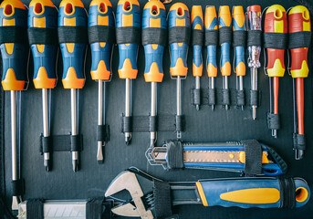 Wall Mural - Screwdrivers set in a toolbox. DIY, maintenance service works concept, top view