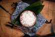 Shirataki rice or noodles on wooden table background. Konnyaku from konjac yam for wok. Healthy japanese diet. Gluten free and carbs free KETO food. Traditional oriental style. Lunch bag. Close up