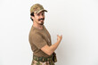 © luismolinero - Soldier man isolated on white background pointing back