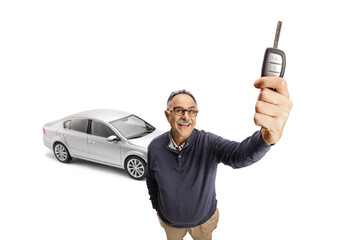 Poster - Happy mature man showing a car key in front of camera