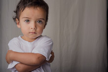 Portrait Of Little Boy With Arms Crossed