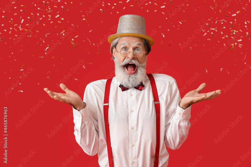 Happy Santa Claus and falling confetti on color background