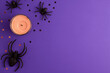 © Four season lover - One big and two tiny black artificial spiders stars and brown candle on purple background