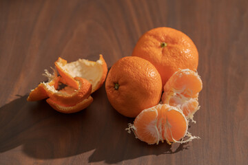 Wall Mural - Peeled tangerines on a walnut wood table