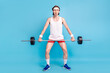 Full length body size photo man keeping barbell wearing sportswear isolated pastel blue color background