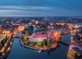 Wall Mural - Aerial view of Wyspa Piasek (or Sand Island)  in the Odra river at dusk, Wroclaw, Poland