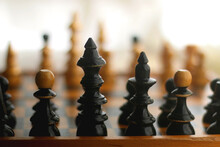 Wooden Chessboard And Vintage Carved Figurines. Selective Focus.