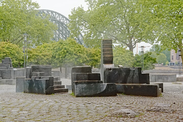 water playground in a city park with green spring trees on an early morning in the city of Cologne, Germany 