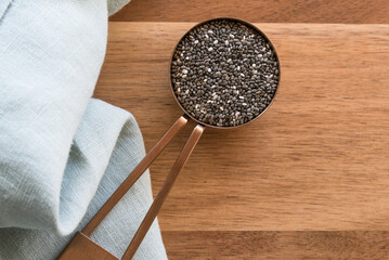 Wall Mural - Black Chia Seeds in a Measuring Spoon