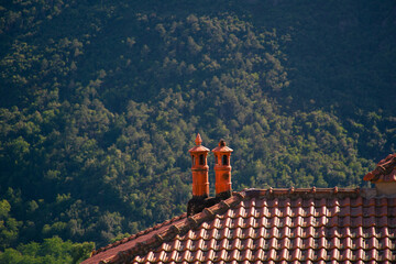 Red smoker on a background of mountains in an italian village. Liguria