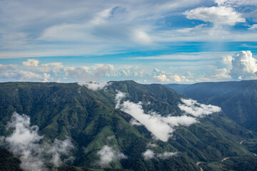 mountain range valley filled with low clouds with dramatic sky at morning