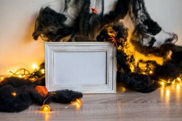 Halloween concept. Photo frame decorations in interior copy space