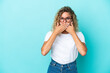 © luismolinero - Girl with curly hair isolated on blue background covering mouth with hands