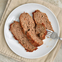 Sticker - Plate of sliced meatloaf overhead view