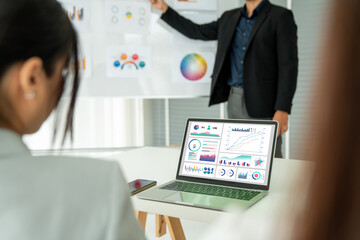 Poster - businesswoman in business meeting using laptop computer proficiently at office for marketing data an