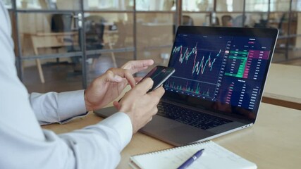 Crypto trader investor broker holding using smartphone app analyzing financial data stock market price on cell phone, checking online trading platform application, buying cryptocurrency.