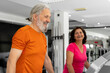 © Milana - A beautiful elderly couple is working out together in the gym