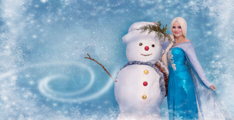  beautiful girl in a princess costume hugs a snowman in a hat and scarf, background, copy space. Happy New Year and Christmas concept.