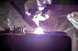 TIG welding. Welding the fuel tank of a motor pump by electric arc welding in argon shielding gas.