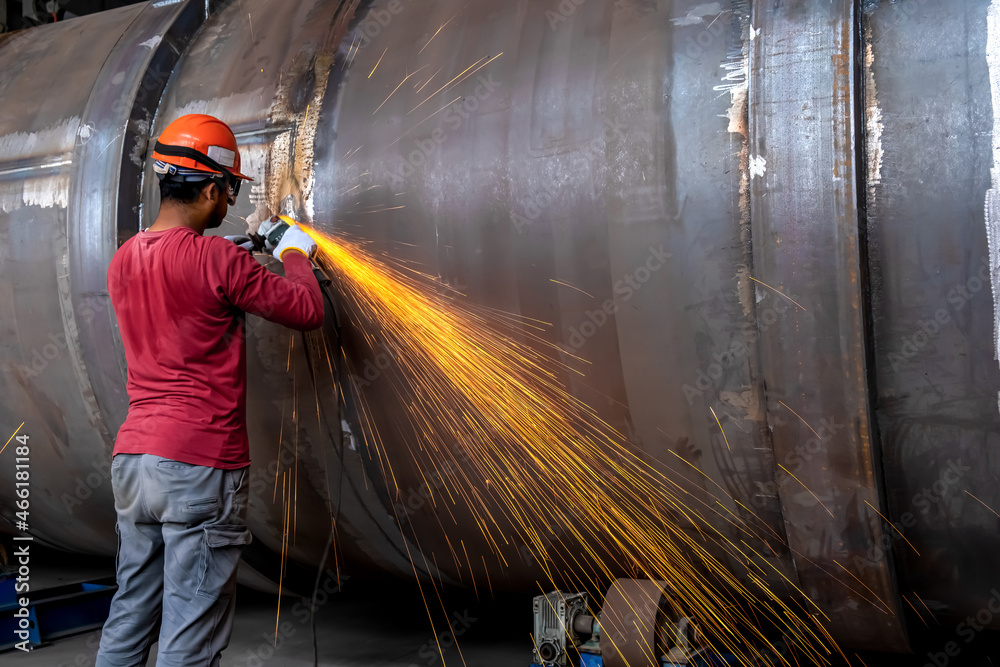 Manufacturing of steel pipes in one of the plant's workshops. Rotation ...