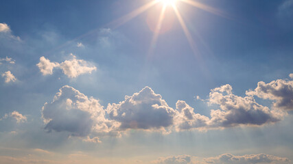 Wall Mural - Wonderful view of cumulus clouds sky with sun light. Daylight yellow sunshine