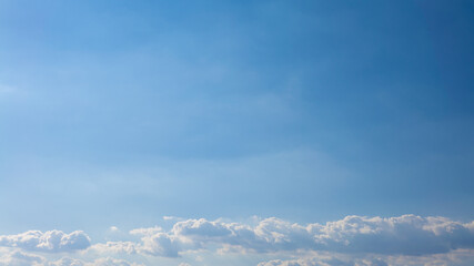Wall Mural - Cumulus clouds with blue sky on a sunny day of summer. Beautiful cloudscape