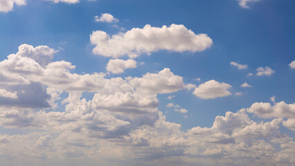 Wall Mural - Cumulus clouds with blue sky on a sunny day of summer. Beautiful cloudscape
