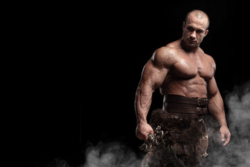 Ferocious muscular ancient warrior barbarian with fantasy sword on black background