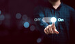 © Dilok - Businessman touching to virtual toggle switch button for change from off to on.