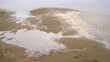 Photo of the river with dirty sand coast