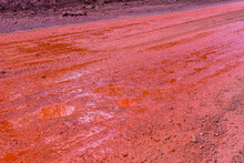 Background Of Red Dirt Road Polluted With The Iron Ore. Environmental Pollution