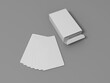 © nicola - 3d rendering of a white deck of cards with packaging on grey background