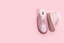 Fashionable Children's Boots For A Girl On A Pink Background.