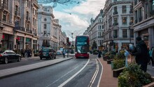 Traffic In London, Regent Street With Pedestrians, Red Buses And Black Cabs Passing By. Timelapse View Of The City Of London.