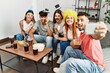 © Krakenimages.com - Group of young friends having party wearing funny costume accessories make selfie by the smartphone at home.