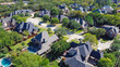 Top view expensive two story mansion houses with swimming pools near a cul-de-sac in Grapevine, Texas, USA