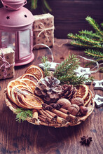 Dry Orange, Star Anise, Cinnamon, Pine Cones And Fir Tree In Rustic Plate On Wooden Table. Homemade Medley Idea For Christmas Mood And Aroma. Eco Friendly Christmas With Homemade Natural Decorations.