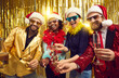 © Studio Romantic - New year eve winter holiday celebration. Happy smiling friends merry christmas disco people group in party santa claus hat holding sparklers, xmas wine glasses posing for camera on glitter background
