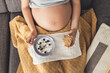 © ikostudio - Pregnant woman eating healthy food