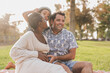 Happy multiracial family enjoy picnic outdoor - Family love concept