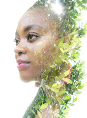 Wall Mural - A portrait of a woman combined with foliage in a double exposure technique.