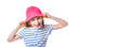 Cute european little girl with pink hat sticking tongue out isolated on white background. Free space