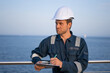 © Igor Kardasov - Inspector with clipboard in sea port