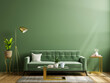 Luxury living room wall mockup with green sofa and decor on dark green background.