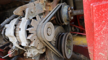 Wall Mural - Old belt on alternator. Old black belt on pulley drive charger or engine alternator with copy space. Selective focus